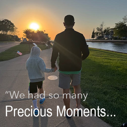 Father and son holding hands walking